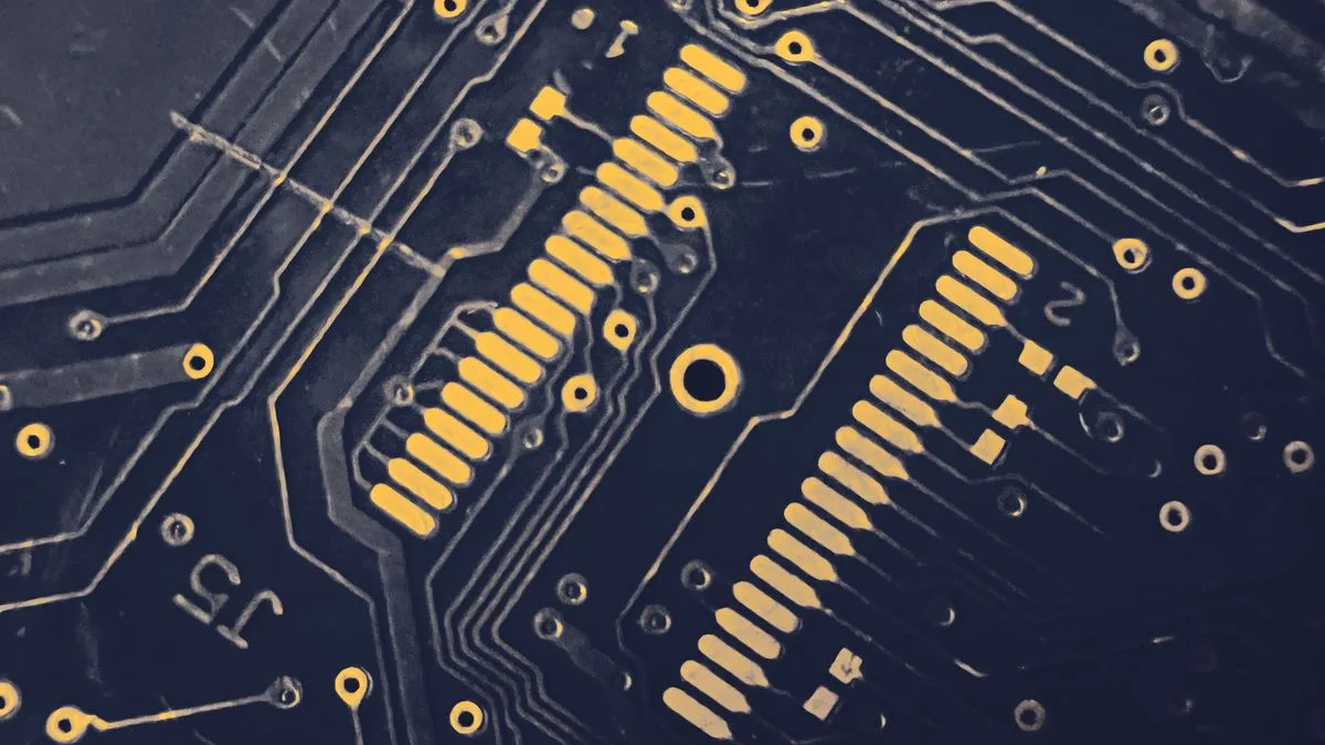Close-up of a dark PCB showing gold signal traces and high-density routing — representing signal integrity challenges in high-speed digital designs